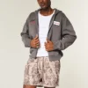 Losse fleece short met camouflageprint tot halverwege het bovenbeen Losse fleece short met camouflageprint tot halverwege het bovenbeen