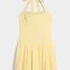 Mini-jurk met halternek en verlaagde taille Mini-jurk met halternek en verlaagde taille