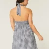 Mini-jurk met open rug en halternek