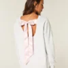Oversized Class of ’26 Sweatshirt met strik op de rug Oversized Class of ’26 Sweatshirt met strik op de rug