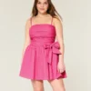 Strapless mini-jurk met strik Strapless mini-jurk met strik