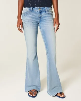 Ultra laag getailleerde distressed lichtgewassen flare jeans met pailletten
