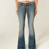 Ultra laag model geborduurde riem Medium wash flare jeans Ultra laag model geborduurde riem Medium wash flare jeans