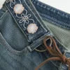 Ultra laag model geborduurde riem Medium wash flare jeans Ultra laag model geborduurde riem Medium wash flare jeans