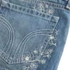 Ultra laag model, medium wash, mini-short van denim met bloemenborduursel Ultra laag model, medium wash, mini-short van denim met bloemenborduursel