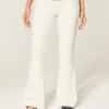 Ultra laag uitgesneden witte flare jeans met geborduurde zakken Ultra laag uitgesneden witte flare jeans met geborduurde zakken