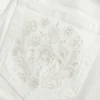 Ultra laag uitgesneden witte flare jeans met geborduurde zakken Ultra laag uitgesneden witte flare jeans met geborduurde zakken