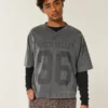 Zwaar baggy cropped varsity T-shirt met voetbalprint Zwaar baggy cropped varsity T-shirt met voetbalprint
