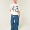 Zwaar baggy cropped varsity T-shirt met voetbalprint Zwaar baggy cropped varsity T-shirt met voetbalprint