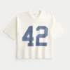 Zwaar baggy cropped varsity T-shirt met voetbalprint Zwaar baggy cropped varsity T-shirt met voetbalprint